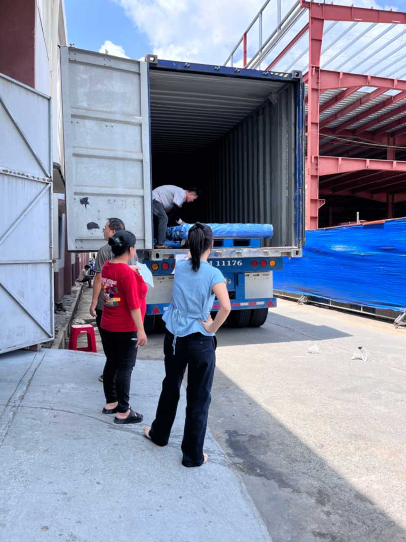 Customer team observing container loading at the Vietnam facility